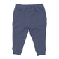 An Angel Dear jogger set in the Footballs Inky Blue pattern is laid flat on a white background. The children's pants, made from soft organic cotton, feature an elastic waistband and cuffs.