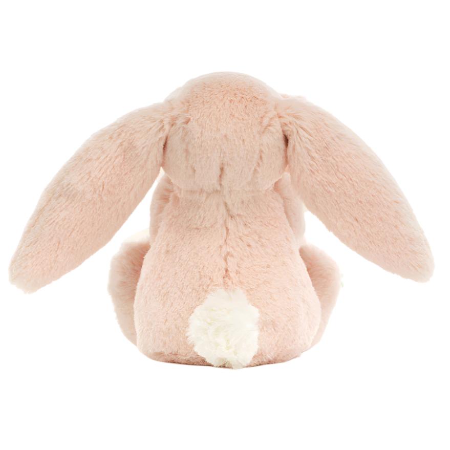 Back view of the Jellycat Bashful Blush Bunny Soother, made by Jellycat from recycled fibers, featuring long ears and a small white tail, sitting upright.