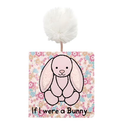 The Jellycat If I Were a Bunny Book - Blush, by Jellycat, is a charming board book featuring a delightful illustration on a floral-patterned backdrop and topped with a fluffy pom-pom, providing newborns with an enchanting sensory experience.