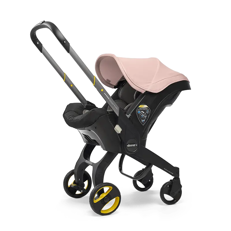 The Doona Car Seat and Stroller by Doona is a stylish black and pink travel system that combines a car seat mounted on a four-wheel frame with an easy-to-use handlebar, providing an ideal mix of style and functionality.