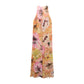 The Floral Dream Dress by Dorothee Schumacher is a sleeveless viscose georgette design with a bold floral print in pink, orange, yellow, and brown on a white background.