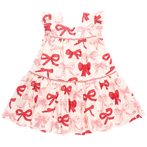 The Pink Chicken Girls' Camelia Dress is a charming child’s dress featuring thick straps, a delightful Valentines Bows print, and elegant velvet-trimmed tiers.