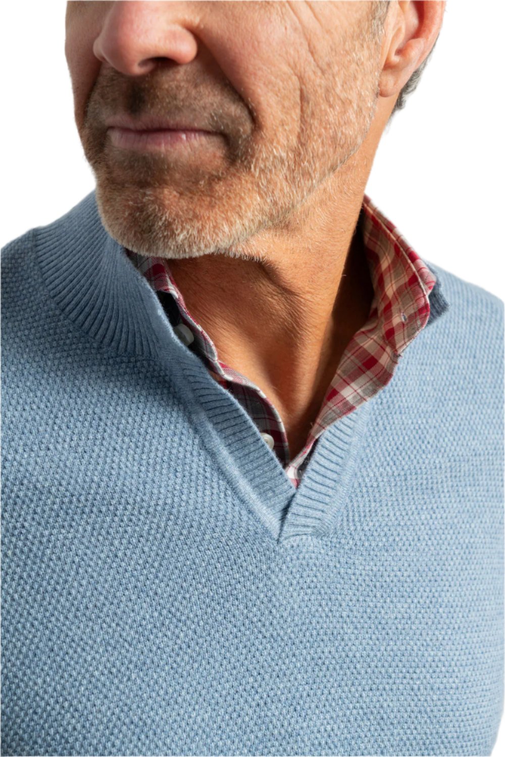 Close-up of a man wearing the Johnnie-O Estaban Quarter Slit Sweater with its textures and layers enhancing his casual yet classic look, reminiscent of Steve McQueen's timeless style.