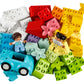 A vibrant assortment of interlocking LEGO® DUPLO® bricks from the Legos - Toyhouse collection, showcasing an array of shapes, sizes, and colors ideal for toddlers. The set also features two toy figures and a small blue car, perfectly designed to inspire creative play.