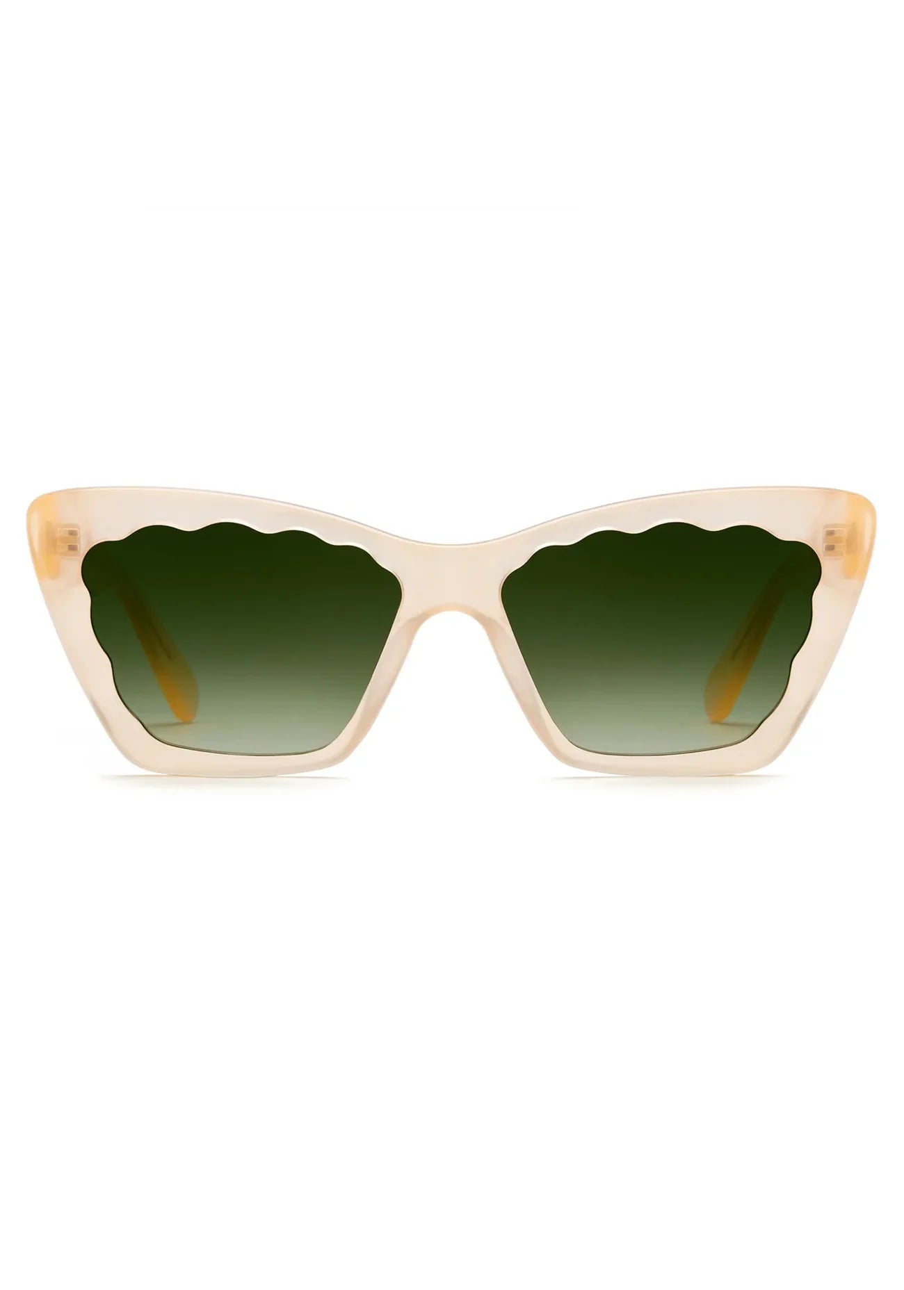 The Brigitte Sunglasses by Krewe are beige cat-eye frames in lightweight acetate, featuring scalloped green gradient lenses, shown front-facing on a white background.