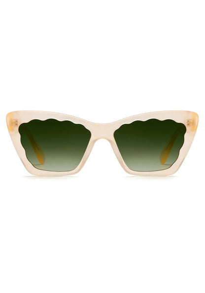 The Brigitte Sunglasses by Krewe are beige cat-eye frames in lightweight acetate, featuring scalloped green gradient lenses, shown front-facing on a white background.