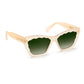 The Brigitte Sunglasses by Krewe feature a beige cat-eye frame made of lightweight acetate, green-tinted lenses, and playful scalloped edges along the wavy top, displayed against a white background.