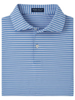 The Peter Millar Bowen Performance Jersey Polo is folded neatly, displaying its blue and white striped design along with the Peter Millar label. Made from performance fabric, this polo shirt seamlessly blends style and comfort. Its tailored fit adds a sophisticated touch, making it ideal for any occasion.