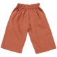 A pair of loose-fitting Pink Chicken Girls' Theodore Pant with an elastic waistband and wide legs made from cozy orange corduroy.