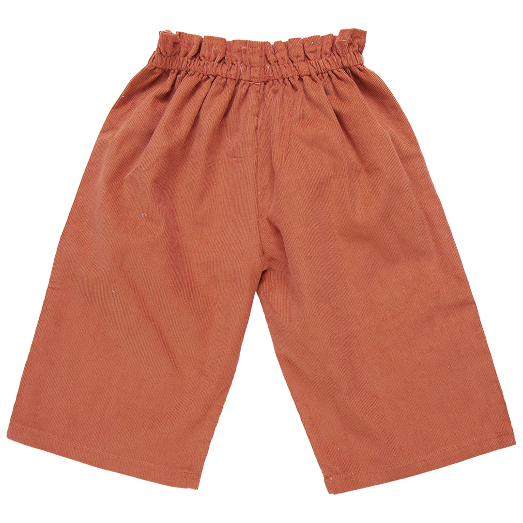 A pair of loose-fitting Pink Chicken Girls' Theodore Pant with an elastic waistband and wide legs made from cozy orange corduroy.