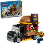 The LEGO® City Burger Truck by LEGO® features a burger-shaped roof, two minifigures, a burger accessory, and mobile takeout fun. Box shown in the background.