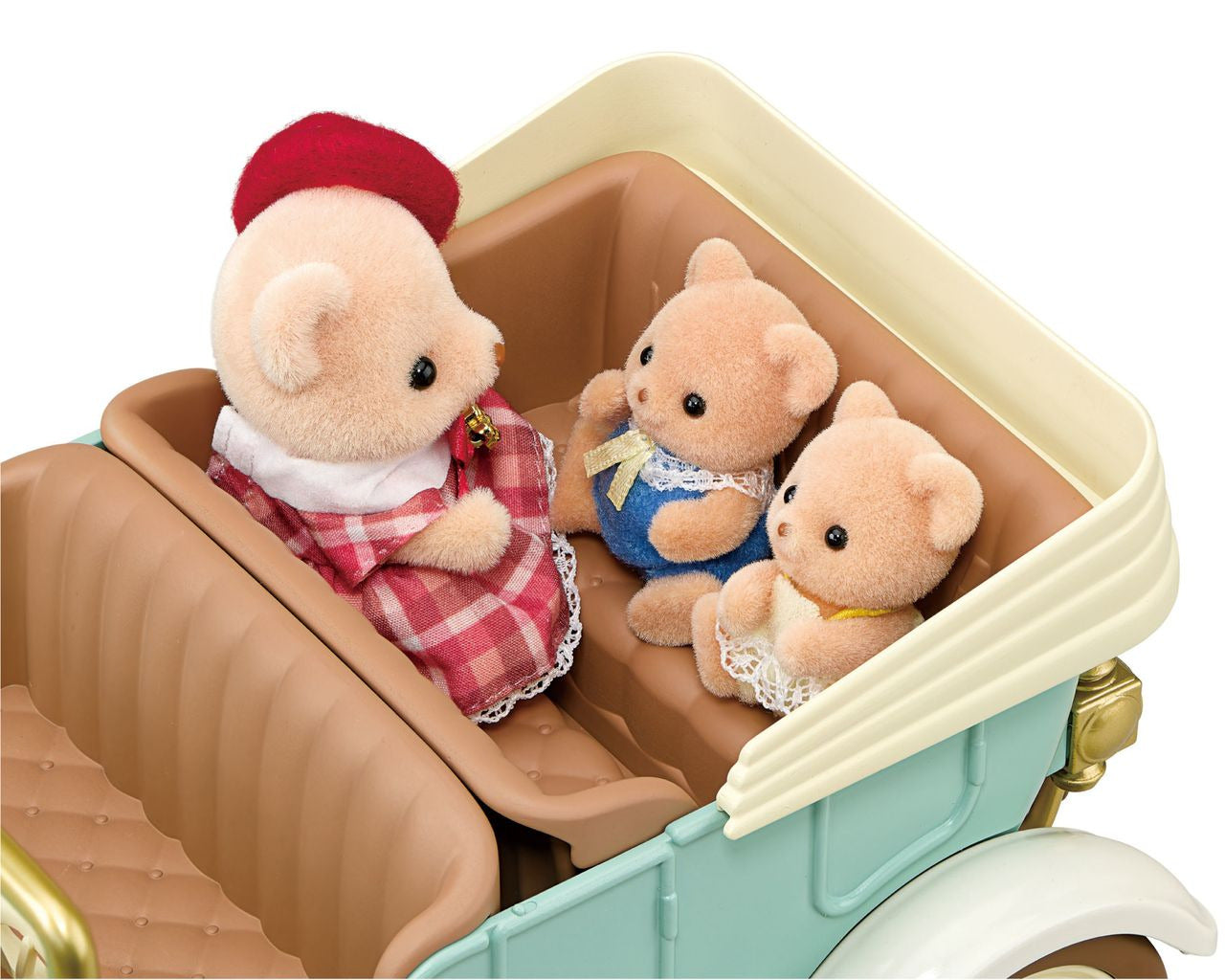 Three Calico Critters figures—a parent and two children—sit inside the Classic Family Car. The parent wears a red hat and dress, while the children are dressed in blue and white outfits, making this Classic Family Car by Calico Critters a delightful addition to any toy car accessories collection.