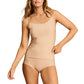A woman models the Commando Butter Cami and matching underwear in ultra-soft fabric, standing with one hand on her hip against a white background.