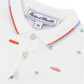 The Baby Boys' and Boys' Spicy Orange Polo by Tartine et Chocolat showcases Miami's sunny spirit with small car, palm tree, and surfboard prints, complete with vibrant orange and blue collar trimming for a City Adventure feel.