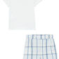 The Baby Boys' Tee and Bloomer Set from Tartine et Chocolat includes a white short-sleeve T-shirt and matching shorts with blue stripes, complete with a playful whale illustration, making it perfect for summer fun.