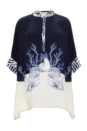 The Ayya Mini Dress by Carolina K features loose fit, navy and white color blocking, sea-inspired prints of coral, seashells, and starfish, striped collar and cuffs accents. Designed in collaboration with a renowned South African artist.