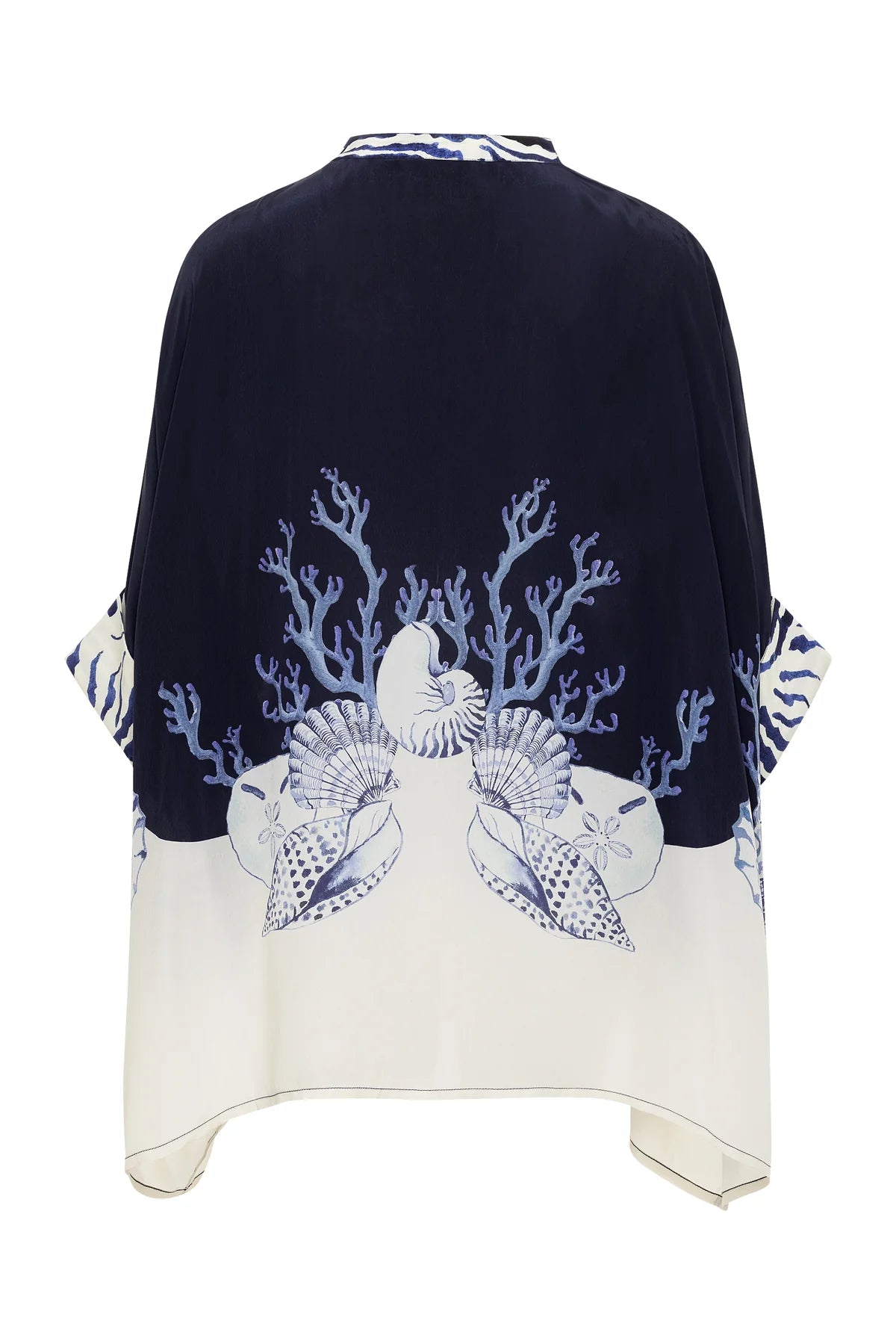 The Ayya Mini Dress by Carolina K features a loose fit and marine-themed print by a South African artist, with coral, shells, and sea plants adorning the back in navy and white.