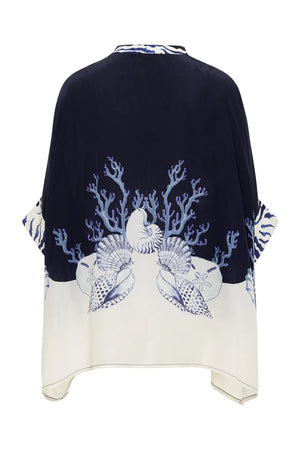The Ayya Mini Dress by Carolina K features a loose fit and marine-themed print by a South African artist, with coral, shells, and sea plants adorning the back in navy and white.