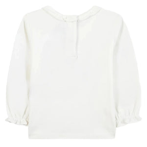 The Tartine et Chocolat Baby Girls' and Girls' Country House Illustration Ruffled T-Shirt in off-white is shown from the back, featuring a ruffle collar and elastic cuffs for extra baby comfort.