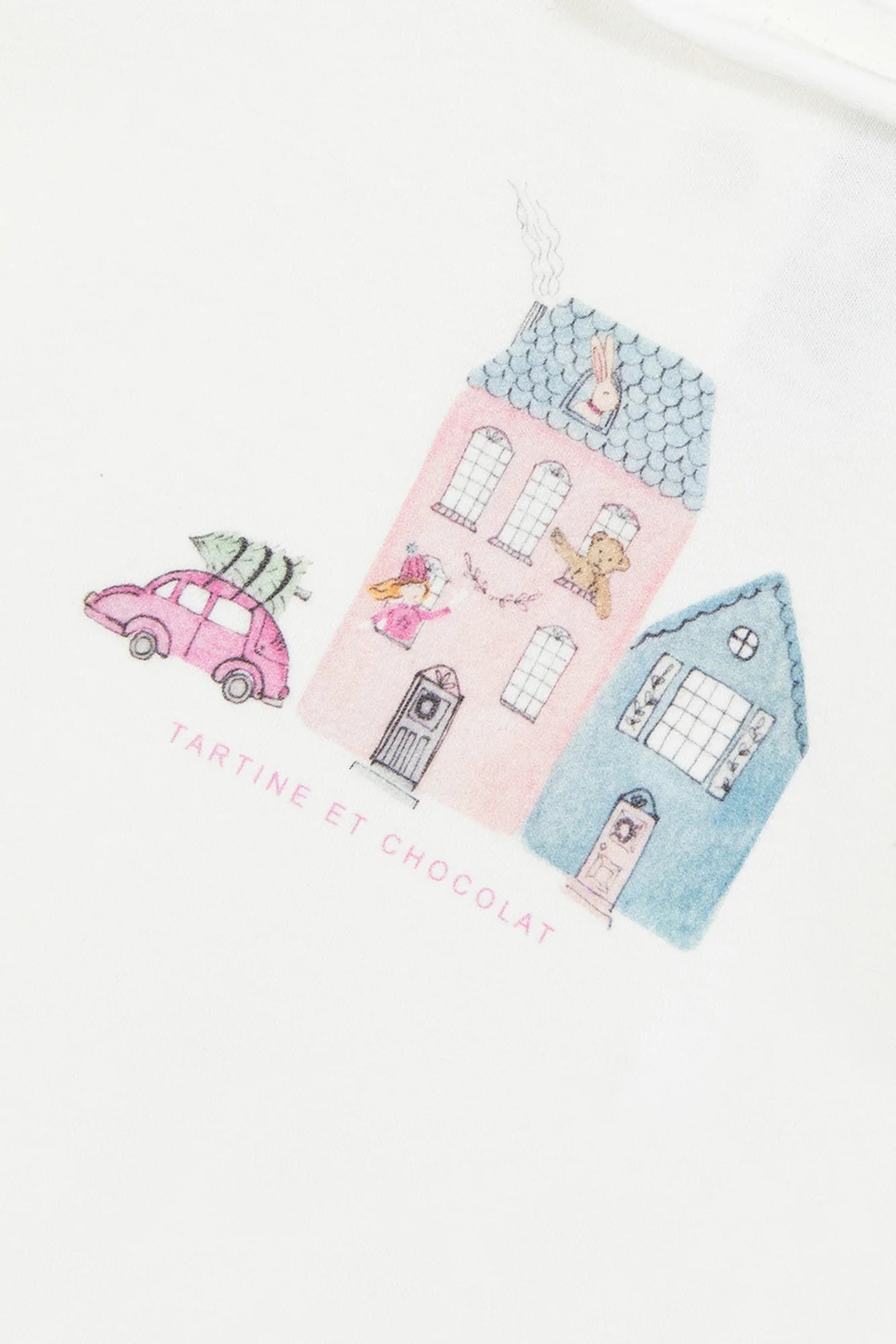 Charming country house illustration with a pink car and animals in windows features on this ruffled T-shirt for baby girls and girls by Tartine et Chocolat—perfect for a cozy, ecru look.