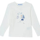 The Tartine et Chocolat Girls' Long-Sleeved Graphic T-Shirt features a Parisian-inspired design of a girl with a stack of books and floating books—perfect for junior girls who love reading.