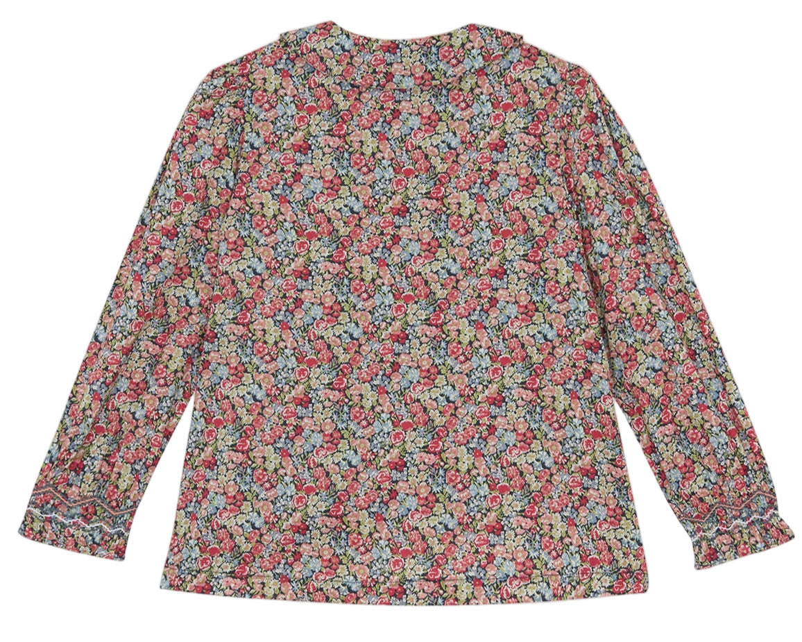 The Tartine et Chocolat Girls' Liberty Smocked Floral Tunic features long sleeves and a vibrant, densely packed Liberty print, shown flat from the back.