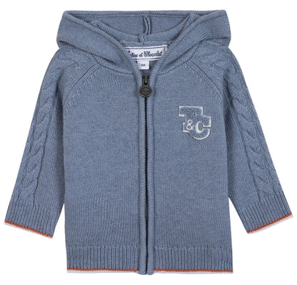 The Tartine et Chocolat Baby Boys' and Boys' TC Signature Knit Zip Jacket features a light blue color, hood, zipper closure, cable knit sleeves, and a “T&C” monogram on the left chest for a classic touch.