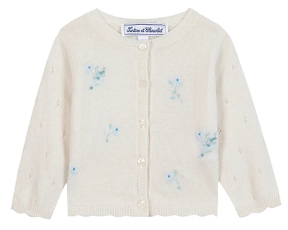 The Tartine et Chocolat Baby Girls' and Girls' Emeraude Embroidery Floral Cardigan features a cream color, front buttons, and delicate light blue floral embroidery.