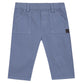 Tartine et Chocolat Baby Boys' and Boys' Trouser Pants in blue-grey, with front pockets, belt loops, and a dark patch on the right pocket. Shown flat on a white background.