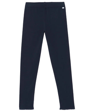 A pair of Tartine et Chocolat Girls' Leggings in plain black, featuring a small logo on the left hip, displayed flat on a white background.