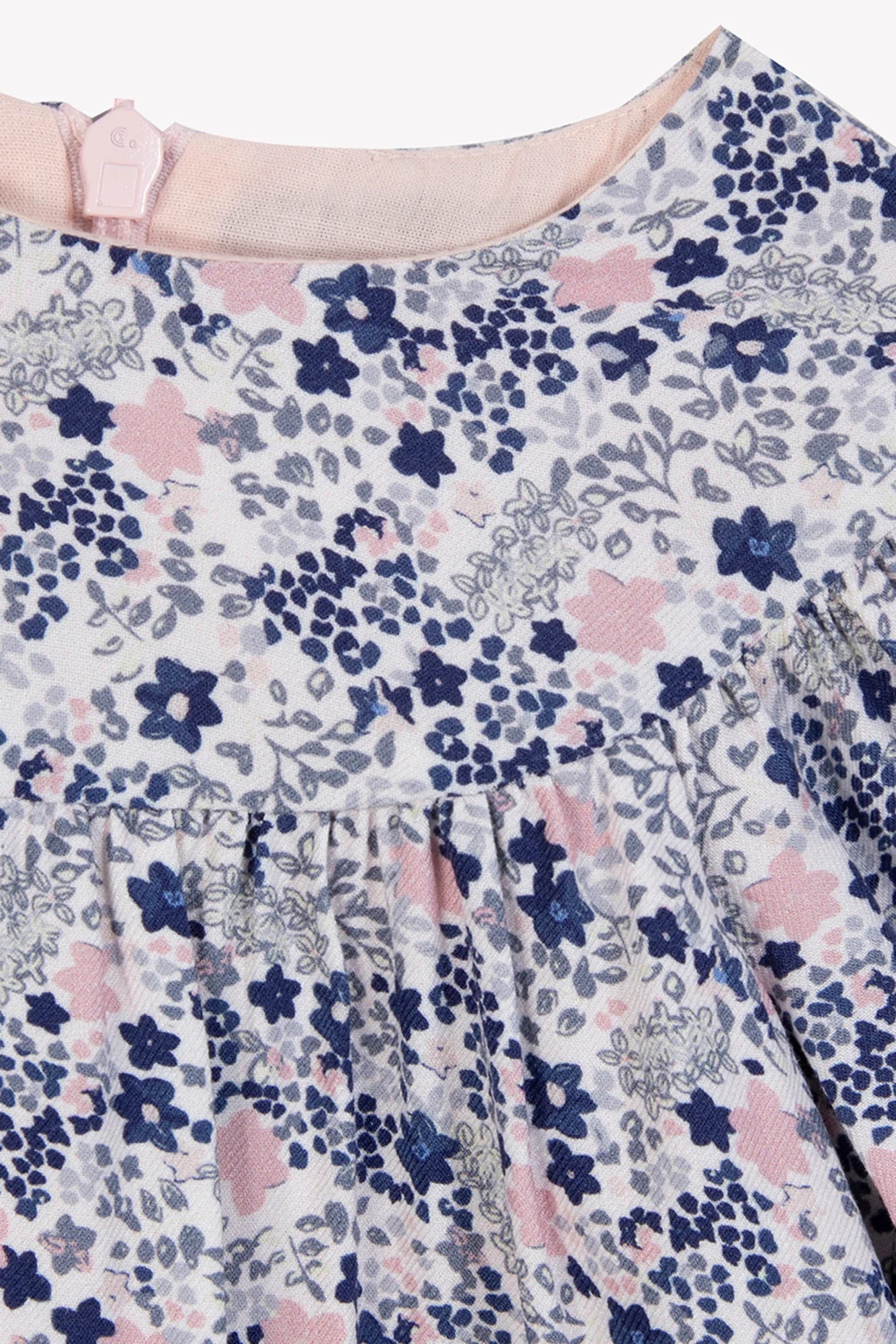 Close-up of Tartine et Chocolat's Baby Girls' and Girls' Small Flower Blueberry Printed Dress, showing gathered fabric at the neckline with blue floral print and pink-grey accents.