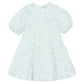 Tartine et Chocolat Baby Girls' and Girls' Puff Sleeve Dress in light blue and white with a Toile de Jouy floral pattern, round neckline, tiered skirt, and long sleeves, laid flat on a white background.