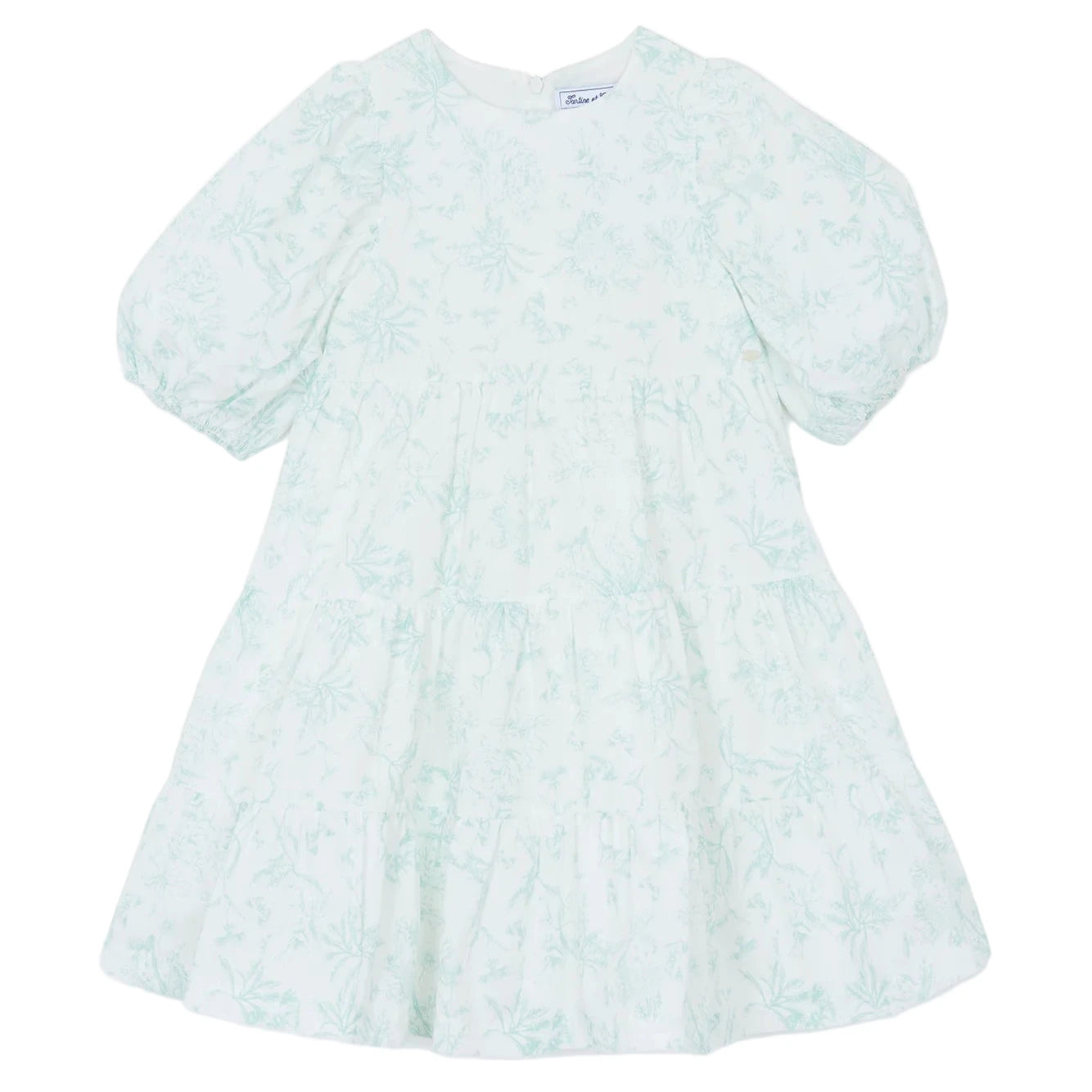 Tartine et Chocolat Baby Girls' and Girls' Puff Sleeve Dress in light blue and white with a Toile de Jouy floral pattern, round neckline, tiered skirt, and long sleeves, laid flat on a white background.