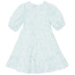 The Baby Girls' and Girls' Puff Sleeve Dress by Tartine et Chocolat features a light blue and white Toile de Jouy floral pattern, short puffed sleeves, and a tiered skirt, displayed against a plain white background.