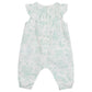 Tartine et Chocolat Baby Girls' Sleeveless Jumpsuit with a white and light green botanical print, ruffled collar, and elasticized ankles is displayed flat against a plain background.