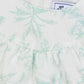 Close-up of the Tartine et Chocolat Baby Girls' Sleeveless Jumpsuit in white with a light green botanical Toile de Jouy pattern, ruffled detail, and back neckline zipper.