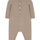 The Tartine et Chocolat Baby Boys' Embrodery Hedgehog Long Sleeved Jumpsuit features beige knit fabric, four front buttons, ribbed cuffs, and a handmade embroidered hedgehog—perfect for cozy newborn wear.