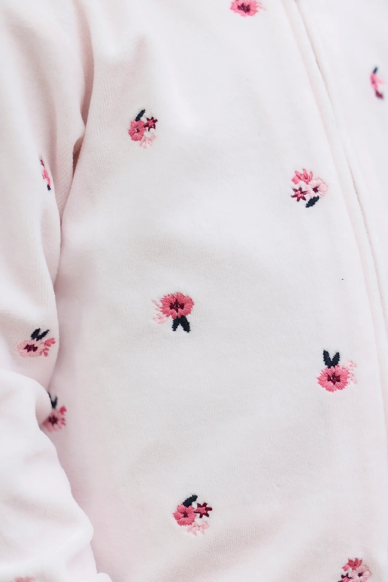 Close-up of the Tartine et Chocolat Baby Girls' and Girls' Velvet Hooded Jogger Set in light pink, featuring small embroidered pink and dark pink flowers—an ideal floral look for stylish girls’ outfits.