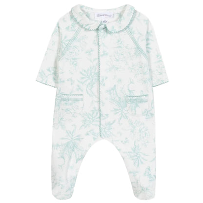 Tartine et Chocolat Baby Girls' Printed Pajamas feature long sleeves, a scalloped collar, two front pockets, and a light green Toile de Jouy-inspired botanical print on soft white fabric.