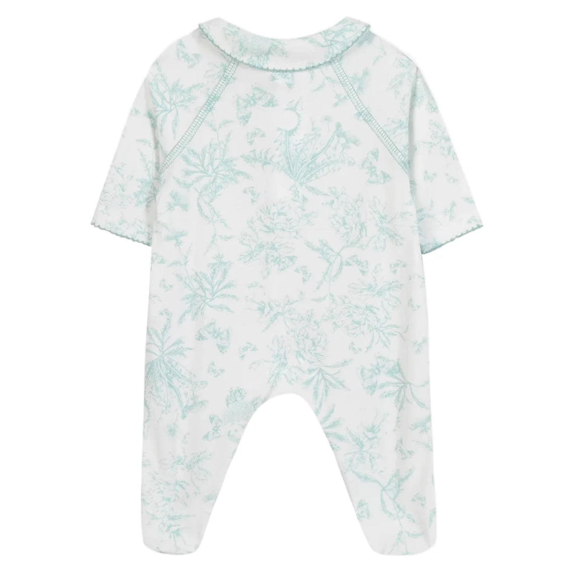 The Baby Girls' Printed Pajamas by Tartine et Chocolat is a white, long-sleeve, footed onesie with a light blue Toile de Jouy-inspired botanical and animal print, shown from the back—ideal as a newborn girl’s pajama set.
