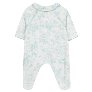 The Baby Girls' Printed Pajamas by Tartine et Chocolat is a white, long-sleeve, footed onesie with a light blue Toile de Jouy-inspired botanical and animal print, shown from the back—ideal as a newborn girl’s pajama set.