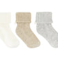 The Tartine et Chocolat Knit Sock 3-Pack features white, beige, and gray ribbed baby socks with fold-over cuffs—an essential addition to any nursery wardrobe.