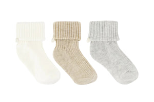 The Tartine et Chocolat Knit Sock 3-Pack features white, beige, and gray ribbed baby socks with fold-over cuffs—an essential addition to any nursery wardrobe.