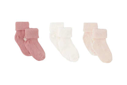The Tartine et Chocolat Knit Sock 3-Pack features three pairs of cotton baby socks in pink, white, and light peach, each with ribbed cuffs—an essential addition to any nursery wardrobe.