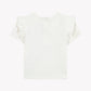 Back view of the Tartine et Chocolat Baby Girls’ and Girls’ Liberty Butterfly T-shirt, showcasing delicate ruffled short sleeves and a button placket at the neckline, beautifully crafted from soft white Liberty fabric.