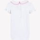 The Tartine et Chocolat Baby Girls’ Peter Pan Collared Onesie features short ruffled sleeves, a Peter Pan collar with pink scalloped trim, delicate embroidered flowers, and three snap buttons at the back.