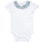 Introducing the Baby Girls’ Liberty Fabric Collar Onesie by Tartine et Chocolat—a sweet white baby bodysuit featuring short ruffled sleeves and a floral Liberty fabric ruffled collar. Convenient snap closures at the bottom make this charming piece perfect for a spring outfit.