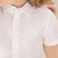 A child is seen from the shoulders to mid-torso wearing the Tartine et Chocolat Baby Boys’ and Boys’ Linen Collared Shirt in white—an elegant, short-sleeved option ideal for special occasions, with part of the face out of frame.