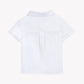 Back view of the Tartine et Chocolat Baby Boys’ and Boys’ Linen Collared Shirt in white, showcasing short sleeves, a yoke, and pleat detail—ideal for special occasions and displayed against a plain white background.