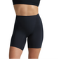 A person models Commando's Zone Smoothing Shorts—high-waisted black compression shorts—shown from midriff to mid-thigh against a white background.